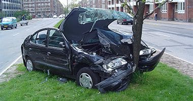 Picture of car after striking a tree.